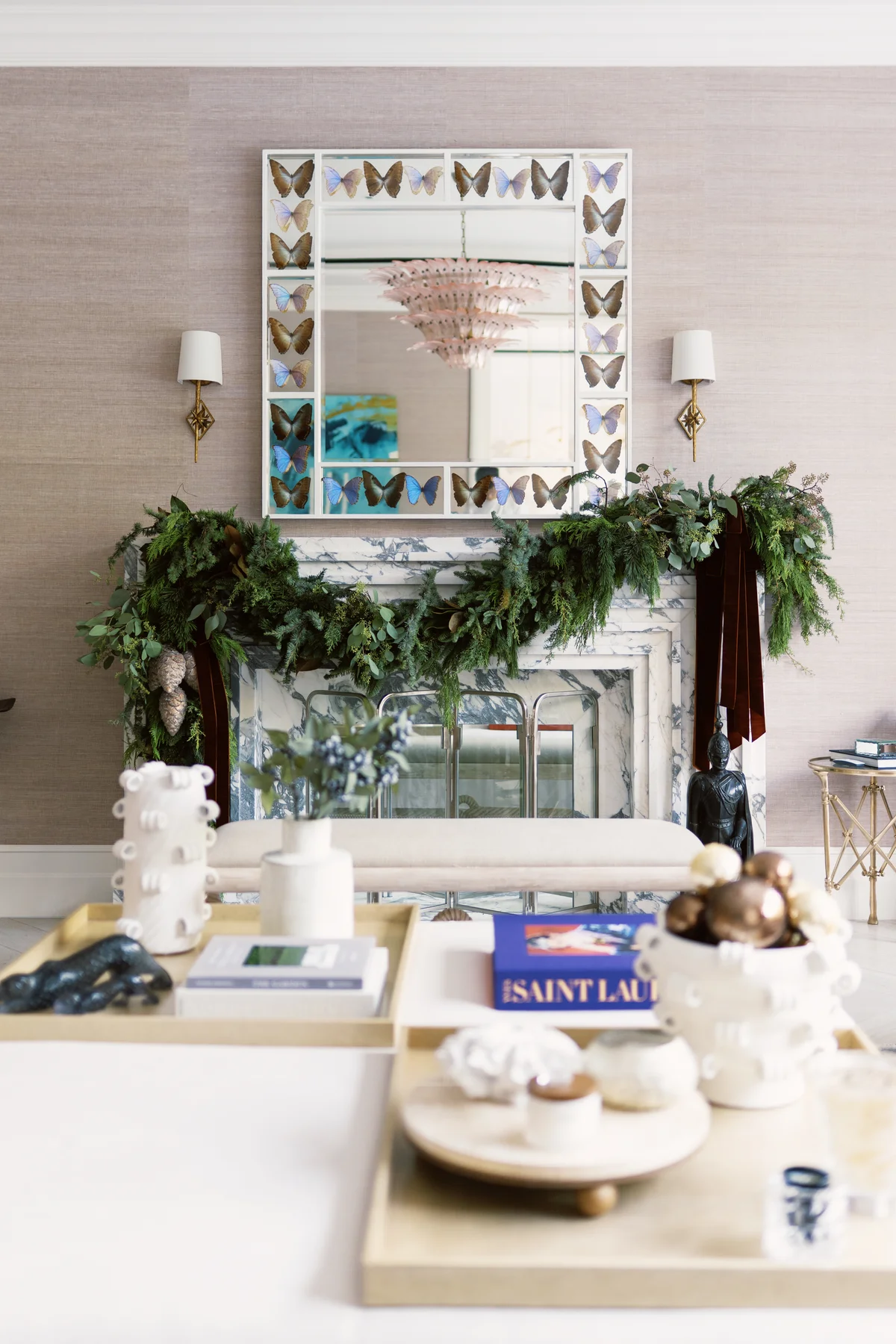 After: marble fireplace decorated with evergreen garlands and burgundy velvet ribbons